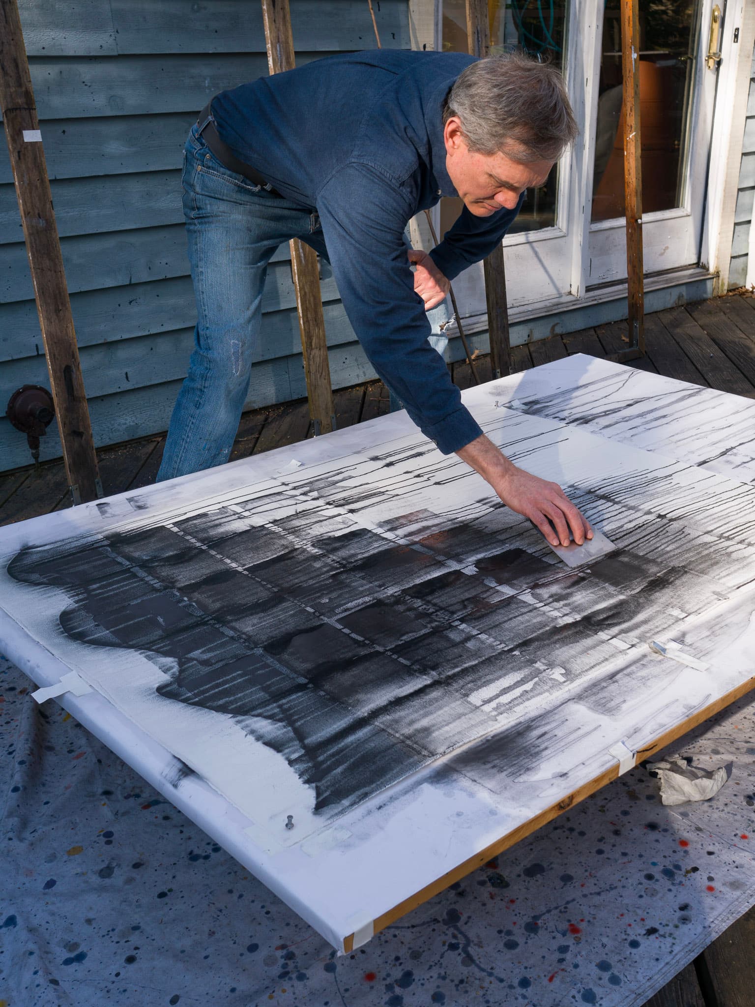 Christopher working on this painting outside