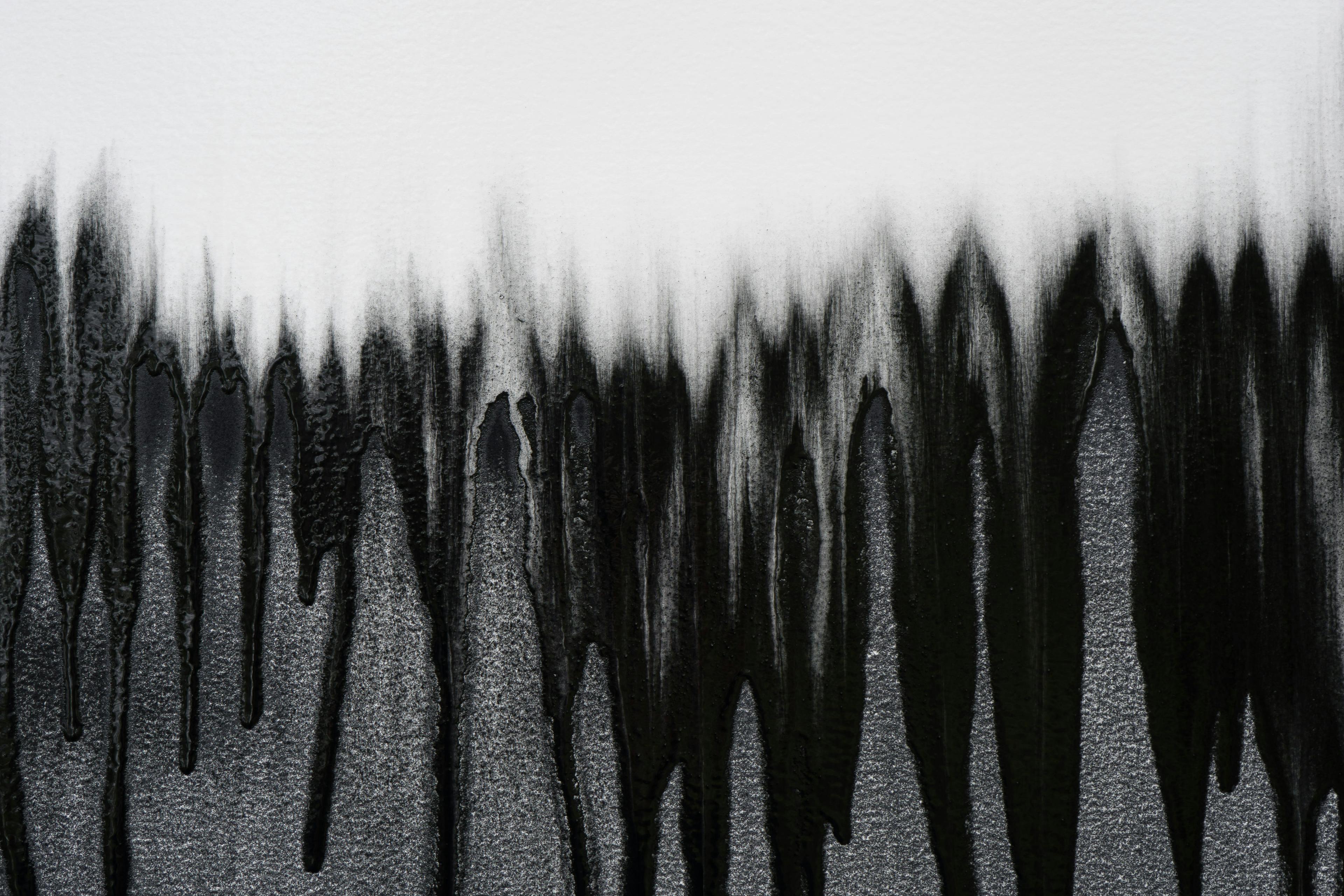 Detail of Christopher's drawing with graphite in dripping arcs